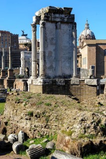 Partially restored historic cella of Temple of the Vesta on brick foundation wall