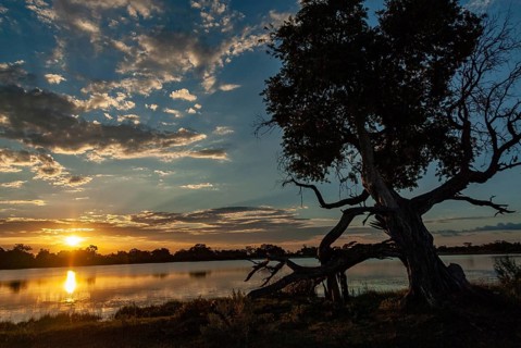 Sunset at a lake in the Kwando area of the Okavango Delta
