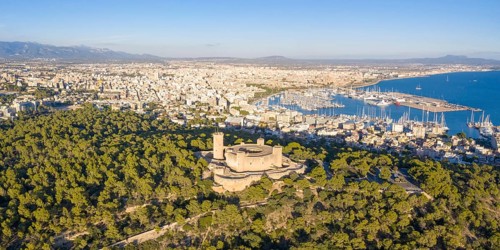 Castell de Bellver castle with harbour holiday travel aerial panorama in Palma de Majorca