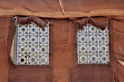 Barred windows on fixed Bedouin tent