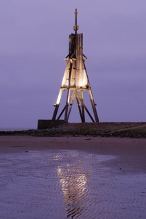 Illuminated Kugelbake at blue hour