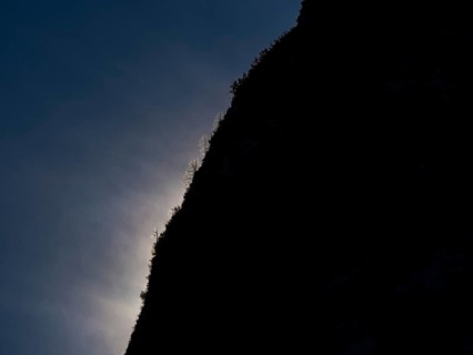 Clouds over mountain silhouette