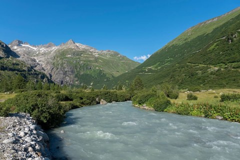Landscape of the Rhone Valley with the Rhone River in front of the massif of the Rhone Glacier