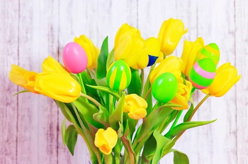 Bouquet of tulips with Easter eggs on a stick