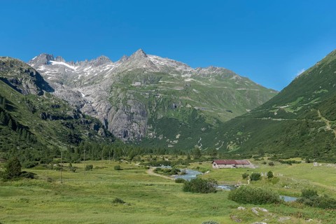 Landscape of the Rhone Valley with the Rhone River in front of the massif of the Rhone Glacier