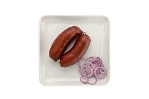 Blood sausage with onion slices on a plate