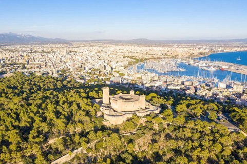 Castell de Bellver castle with harbour holiday travel aerial view in Palma de Majorca