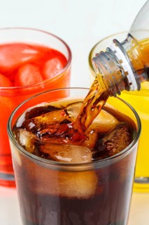 Drinks Pouring Lemonade Cola Soft Drinks in a Glass