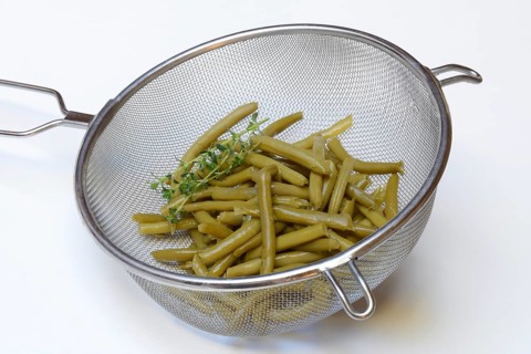 Green beans and savory in colander