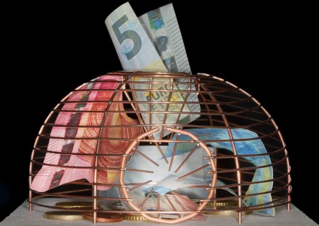 Euro coins and paper money lying in a live trap for mice