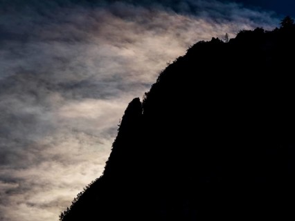 Clouds over mountain silhouette