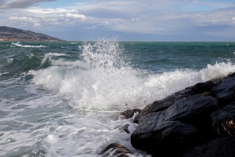 Strong swells during storm break on seawall in Sanremo