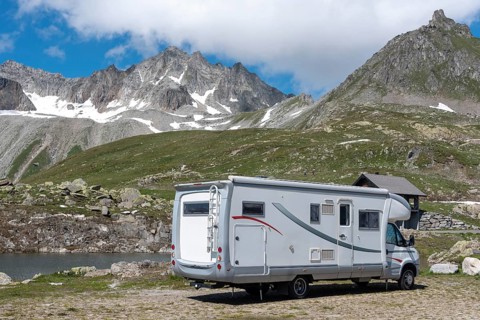 Motorhome in alpine landscape near Nufenen Pass