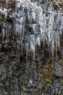 Icicles forming an icefall in the mountain in winter. France
