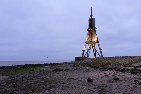 Illuminated Kugelbake at blue hour