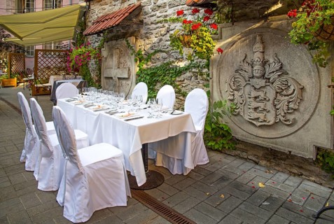 Festively set table in Old Town courtyard