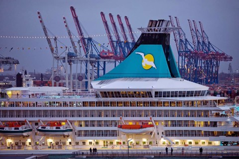 Cruise ship Artania at Hamburg Cruise Center Altona with the cranes of the harbour in the background