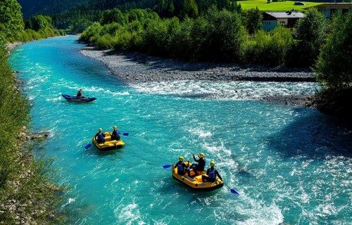 Water sportsmen rafting on the Lech in Austria