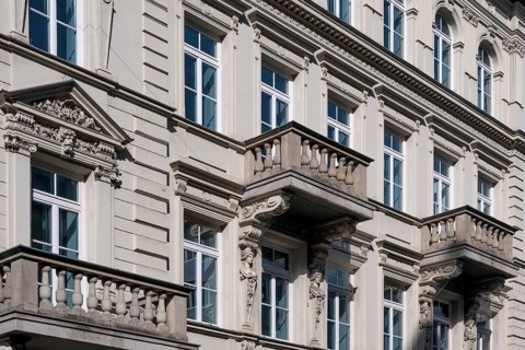 Classicist facade with balconies and caryatids