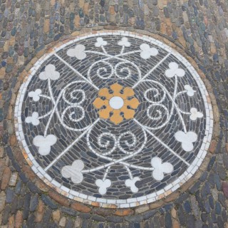 Ornament as paving mosaic on the pavement