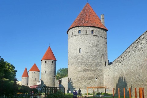 Medieval city fortification with battlements and defence towers