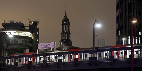 Baumwall underground station with the spire of St Michaelis church at night