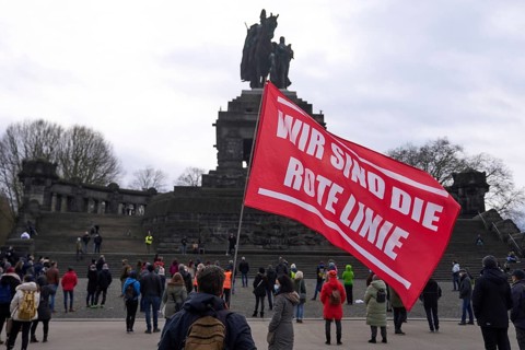 Opponents of the Corona measures demonstrate with flags and banners at the Deutsches Eck in Koblenz