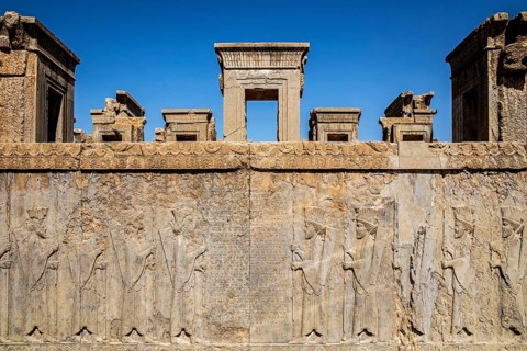 Persian guards at the west staircase of Darius Palace with cuneiform writing
