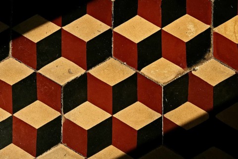 Old tile floor with mosaic pattern