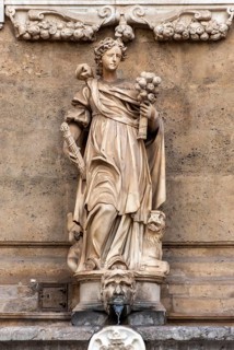 Statue representing summer season at Fountain of Quattro Canti