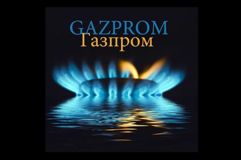 Gas flame with Gazprom logo reflected in the water