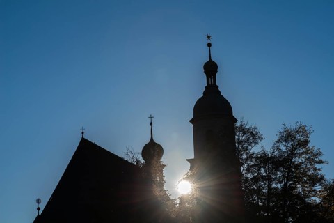 Silhouette of the Franciscan church and tower of the parish church
