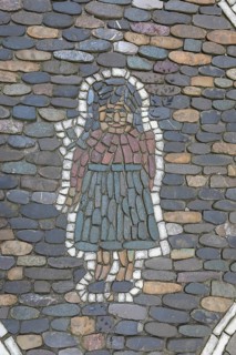 Female figure as pavement mosaic on the pavement