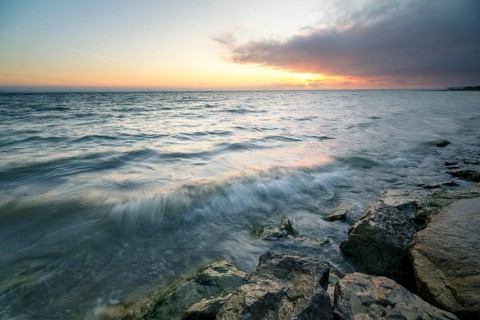 Morning atmosphere with light wind and waves Bank stabilisation in the harbour of Guettingen