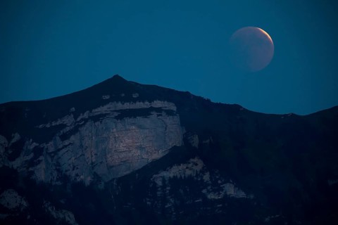 Lunar eclipse above the mountain station of Hohen Kasten