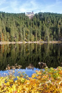 Mummelsee and mountain Hornisgrinde in Black Forest landscape nature in autumn in Seebach