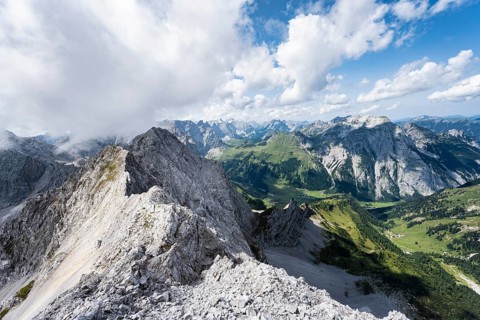 View from the summit of Lamsenspitze over rocky ridge to Schafkarspitze