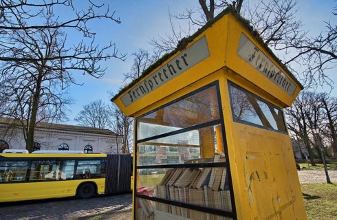 Old telephone booth where books are offered for exchange
