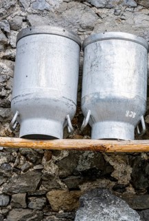 Milk cans at an alpine pasture in the Eng