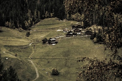 Old farms on mountain meadow