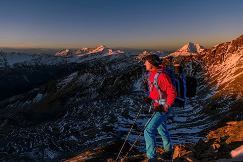 Mountaineers in front of snowy peak of Monte Cevedale in morning light