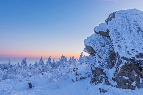 Snow Covered Winter Landscape with Rock at Dawn. Grosser Feldberg