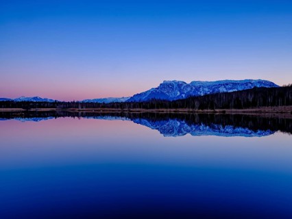 Untersberg at dusk reflected in the moor lake in Ainringer Moor