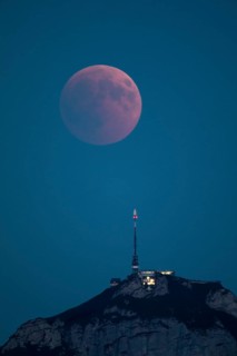 Lunar eclipse above the mountain station of Hohen Kasten