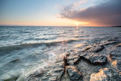 Morning atmosphere with light wind and waves Bank stabilisation in the harbour of Guettingen