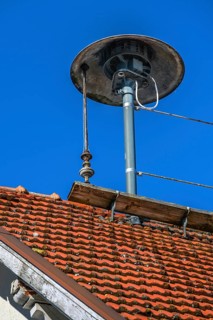 Roof with obsolete motor siren and lightning conductor