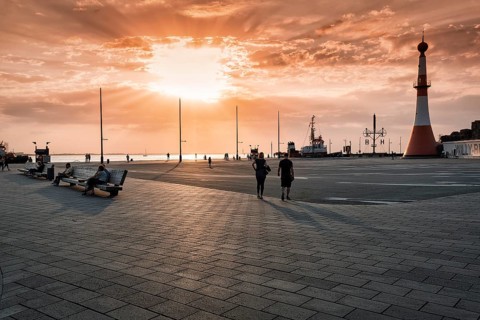Willy-Brandt-Platz with lighthouse Unterfeuer at sunset