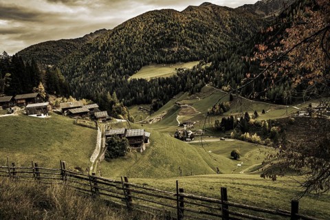 Old farms on mountain meadow