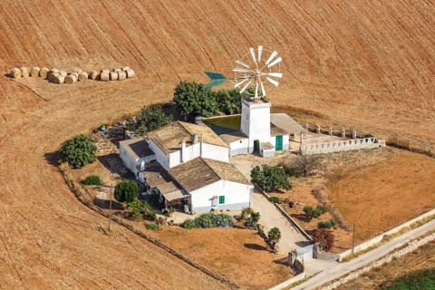 Traditional finca farm with windmill landscape aerial view in Majorca