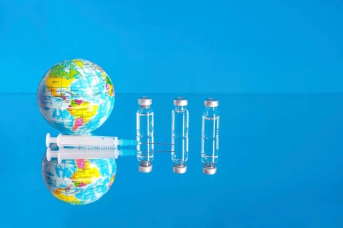 Vaccine bottles and syringe